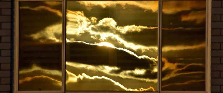 P-Info-Sunrise-reflected-in-trio-of-windows