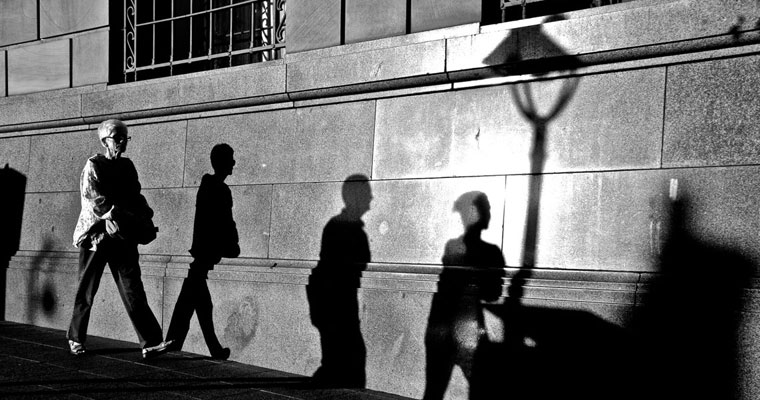 P-personal-safety-B&W-older-lady-walking-with-3-shadows