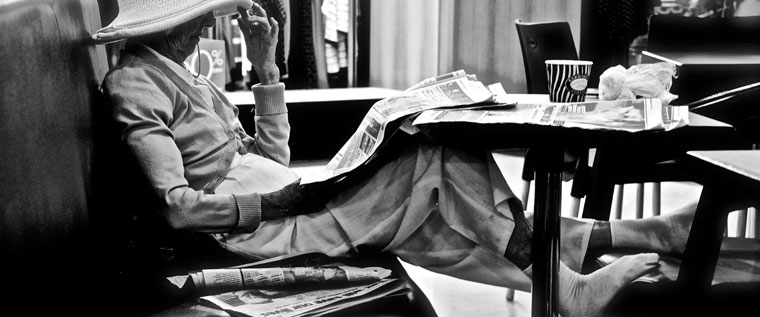 P-policy-Older-lady-reading-newspaper